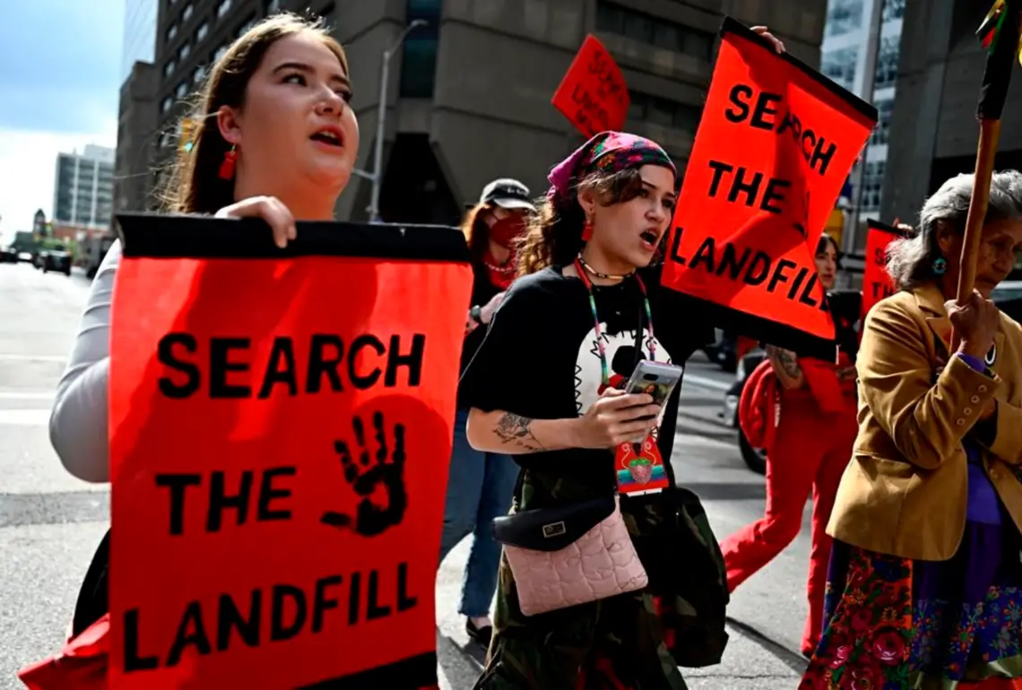Cambria Harris, daughter of Morgan Harris, centre, and Jorden Myran, sister of Marcedes Myran, march towards Parliament Hill on an International Day of Action to Search the Landfills, in Ottawa, on Monday, Sept. 18, 2023. The remains of Morgan Harris, Marcedes Myran and another woman named as Mashkode Bizhiki’ikwe, or Buffalo Woman, killed by an alleged serial killer, are believed to be in a landfill north of Winnipeg. THE CANADIAN PRESS/Justin Tang