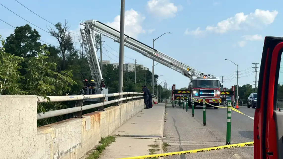 Firefighters used an elevated ladder, deployed over the side of the Adelaide Street bridge in London to search for the child from above. (Isha Bhargava/ CBC News)