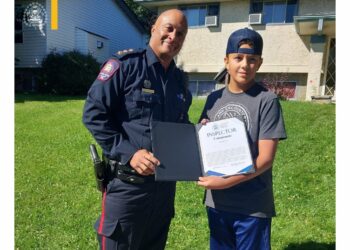 Photo of Calgary youth Ryder recognized by police for helping in a missing child incident