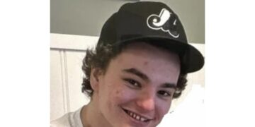 Photo of missing man Tie, age 21, from Barrie, Ontario.