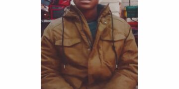Photo of missing man Joshua, 25, Black male wearing brown jacket and glasses, from Durham Region