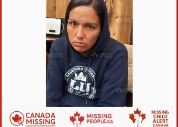 Photo of missing woman Melissa, age 39, from Timmins, Ontario, wearing a dark blue Laurentian University hoodie.