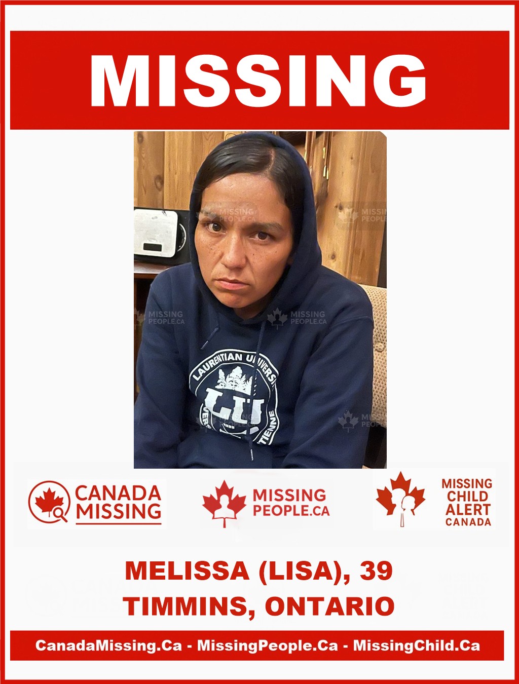 Photo of missing woman Melissa, age 39, from Timmins, Ontario, wearing a dark blue Laurentian University hoodie.