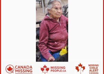 Photo of missing woman Helen Noskey, age 70, from Peace River, Alberta, wearing a red sweater and blue pants