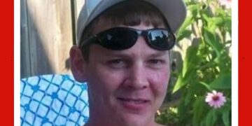 Photo of missing man Trever Andrews, 26 at disappearance (born 1983), short light-brown hair, green eyes, red birthmark on left cheek, last seen London 2009.