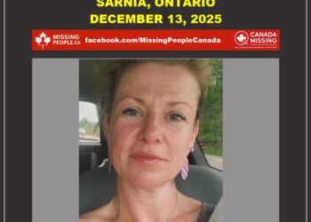 Photo of missing woman Nicol McColl, age 47, from Sarnia, Ontario (blonde hair, blue eyes, smiling in car).