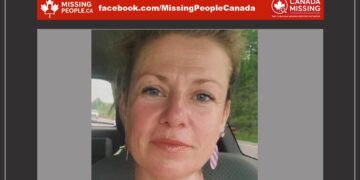Photo of missing woman Nicol McColl, age 47, from Sarnia, Ontario (blonde hair, blue eyes, smiling in car).