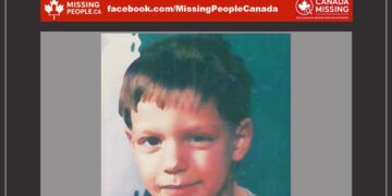 Photo of missing child Yanick Fortin, age 6, from Matawin, Quebec in 1991 (young boy with auburn hair, black eyes).